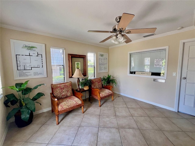 living area featuring ceiling fan, ornamental molding, and light tile patterned floors