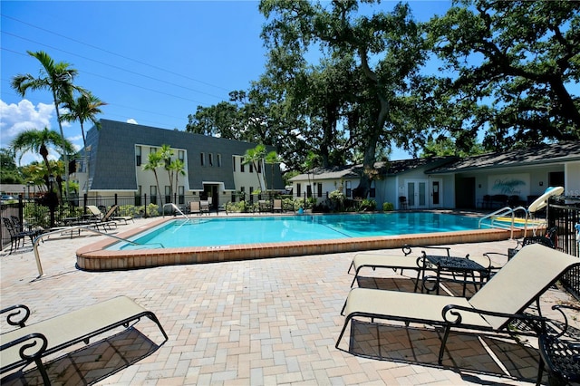 view of swimming pool featuring a patio area