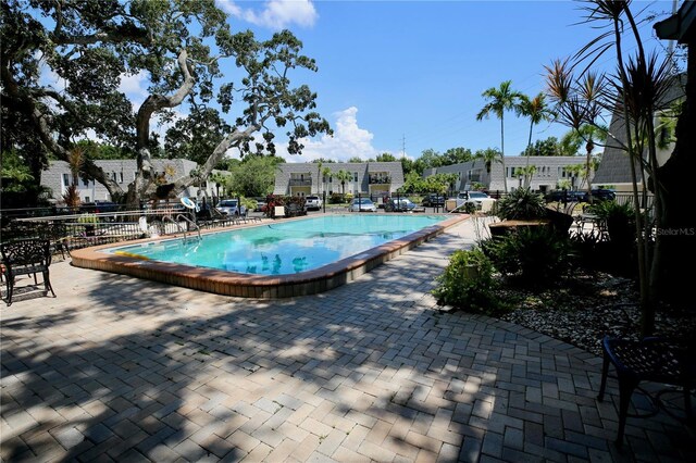 view of pool featuring a patio area