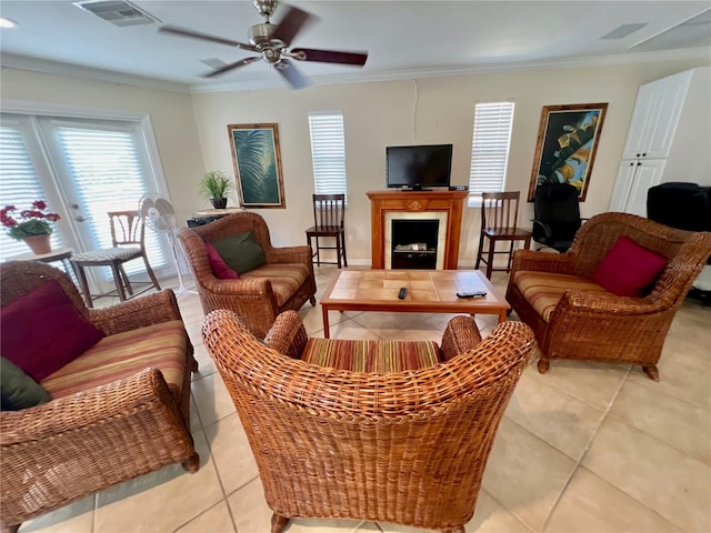 living room featuring crown molding and light tile patterned floors