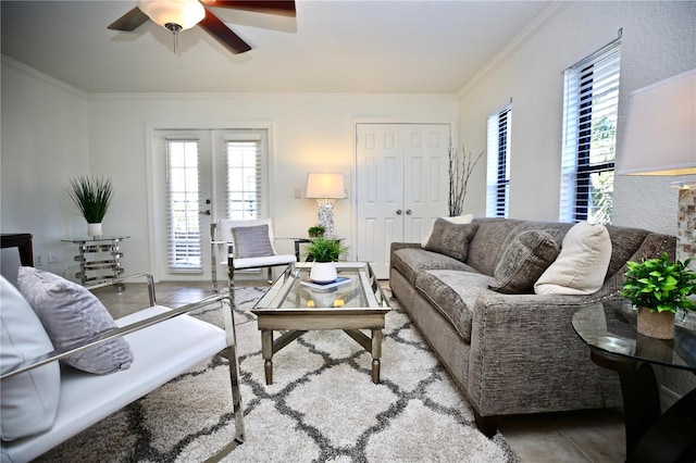 living room with ceiling fan, french doors, hardwood / wood-style flooring, and ornamental molding