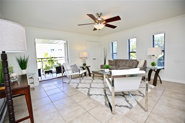 living room with ceiling fan, ornamental molding, and light tile patterned floors