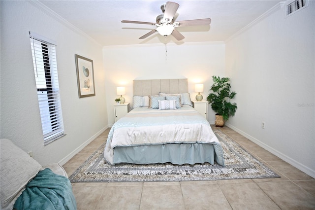 tiled bedroom featuring ceiling fan and ornamental molding