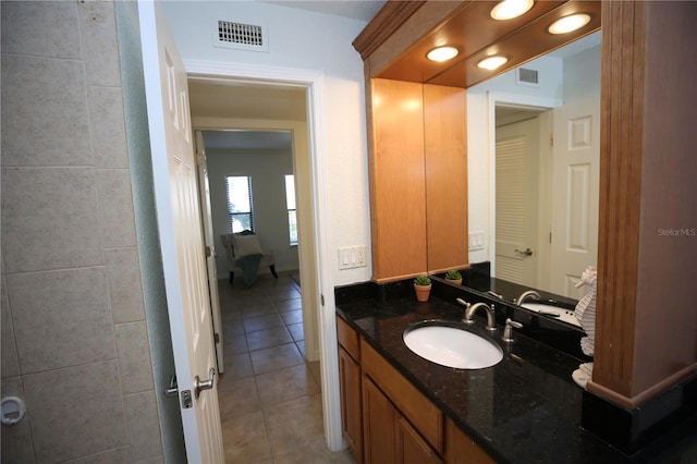 bathroom featuring tile patterned floors and vanity