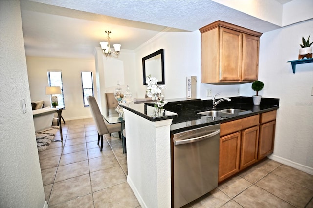 kitchen with stainless steel dishwasher, crown molding, sink, a notable chandelier, and dark stone countertops