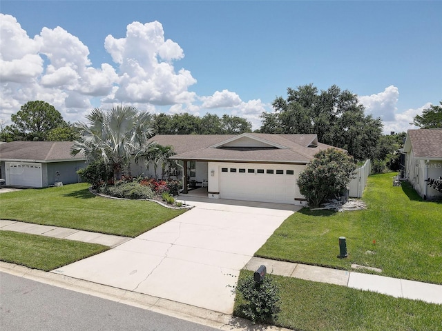 view of front of home featuring a garage and a front lawn