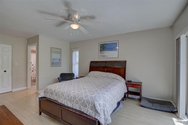 bedroom featuring ceiling fan and light hardwood / wood-style floors