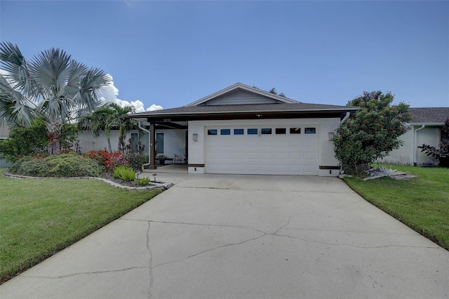 ranch-style home featuring a garage and a front yard