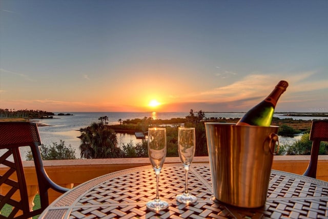 patio terrace at dusk with a water view