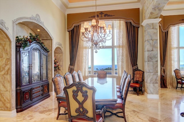 dining room featuring tile patterned flooring, ornate columns, a wealth of natural light, and an inviting chandelier