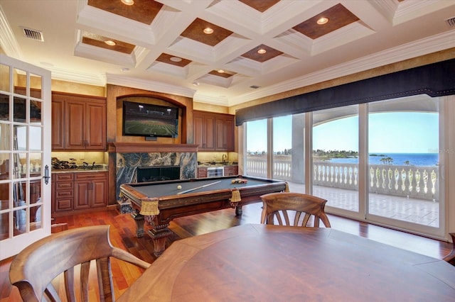 rec room featuring beamed ceiling, a fireplace, pool table, crown molding, and coffered ceiling