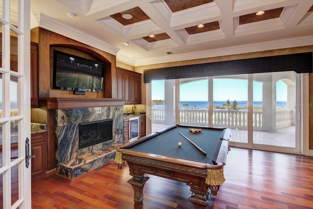 rec room featuring a wealth of natural light, coffered ceiling, a high end fireplace, and billiards