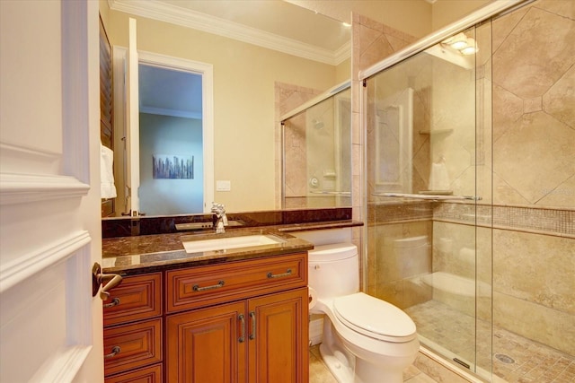 bathroom featuring tile patterned flooring, a shower with door, toilet, vanity, and ornamental molding