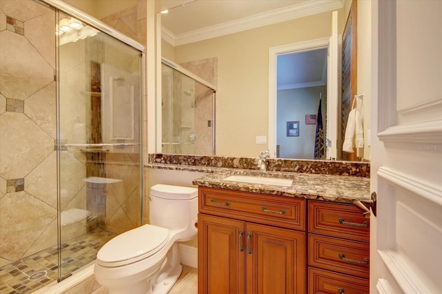 bathroom with a shower with shower door, crown molding, toilet, and vanity