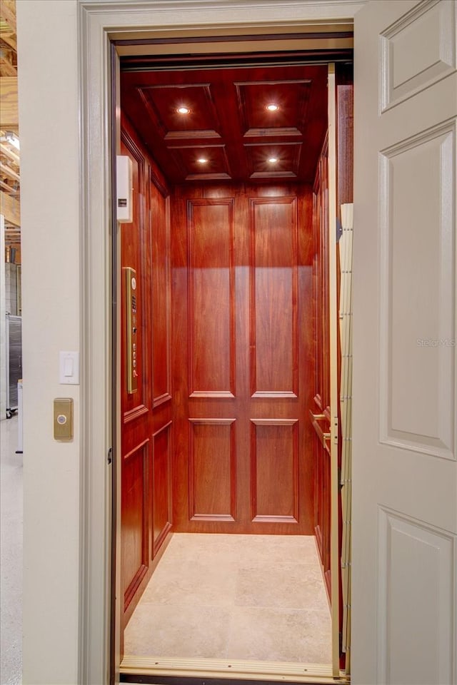 room details with coffered ceiling and elevator