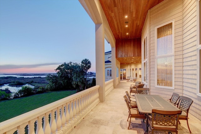 view of balcony at dusk