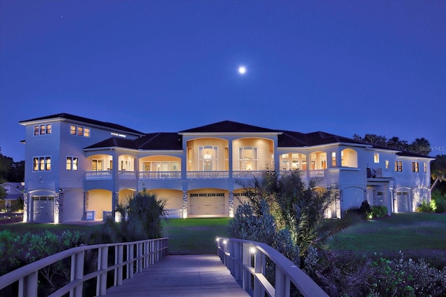 view of front of house with a balcony and a garage