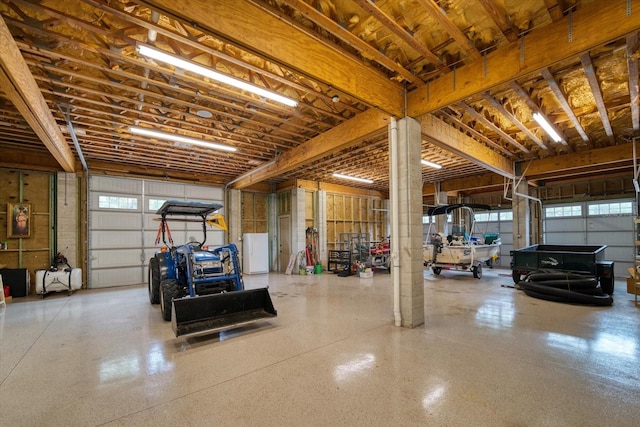 garage featuring white fridge