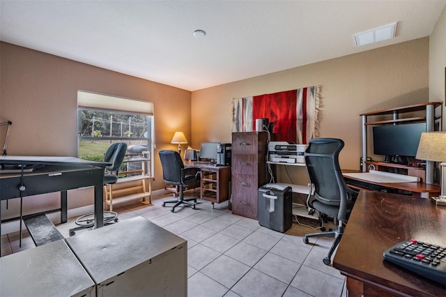 office area with tile patterned flooring and visible vents