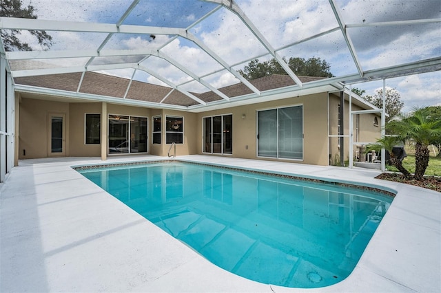 outdoor pool featuring a lanai and a patio area