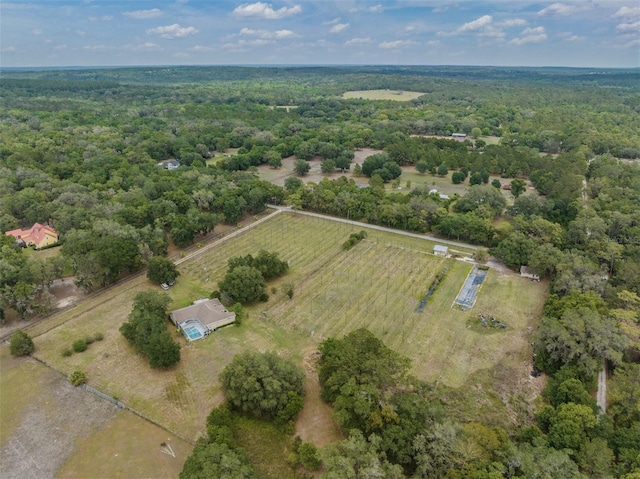 birds eye view of property with a rural view and a view of trees