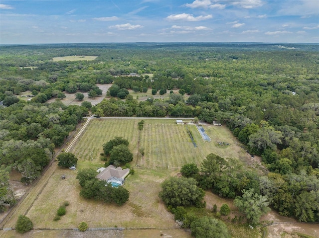 birds eye view of property with a rural view and a view of trees
