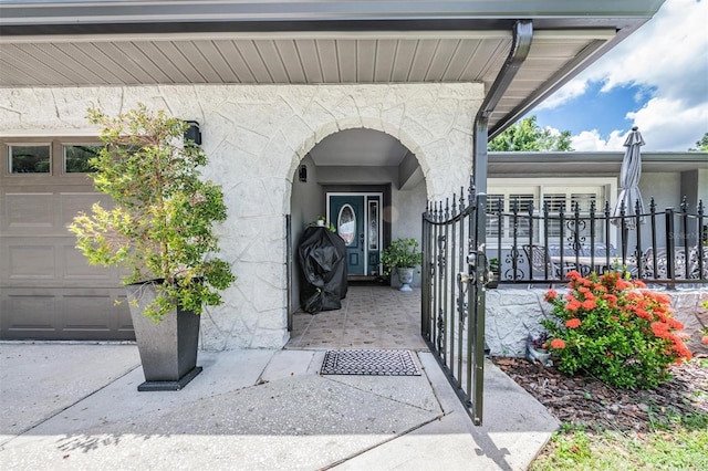 doorway to property featuring a garage