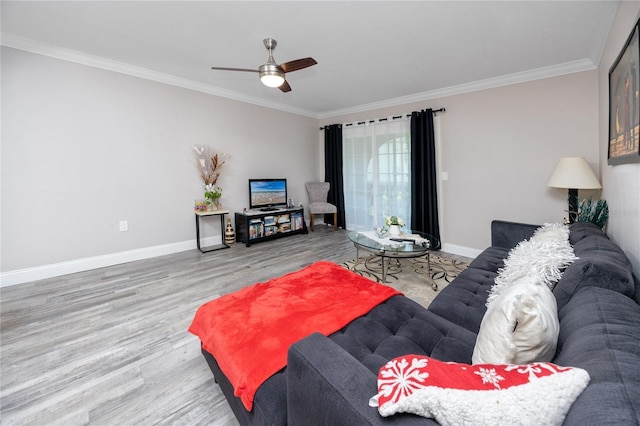 living room with ceiling fan, crown molding, and wood-type flooring