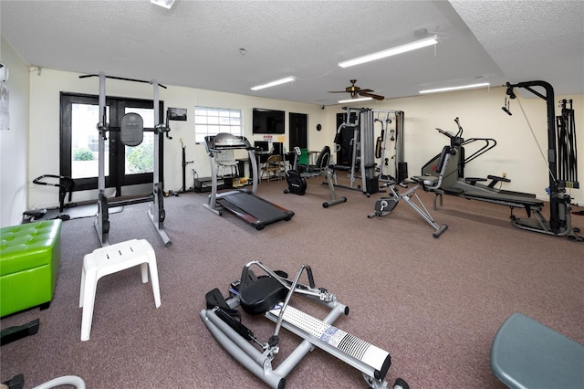 gym with a textured ceiling