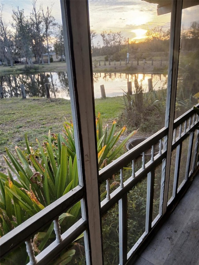 balcony featuring a water view