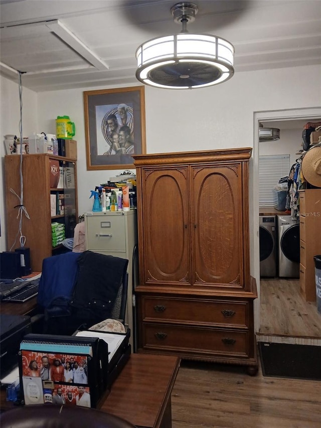 interior space featuring dark hardwood / wood-style flooring and separate washer and dryer