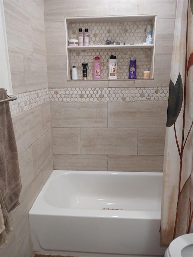 bathroom featuring shower / bathtub combination with curtain