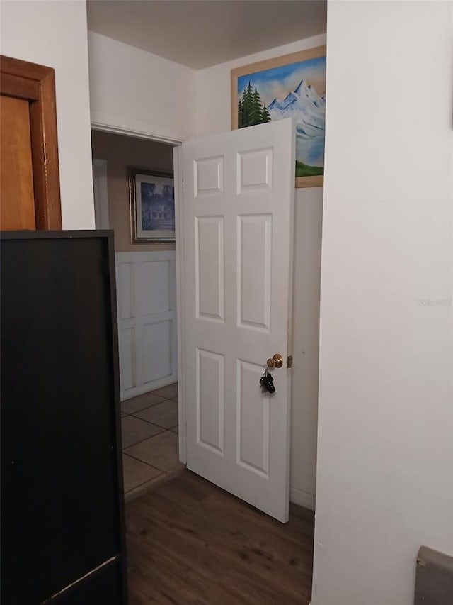 hallway with dark wood-type flooring