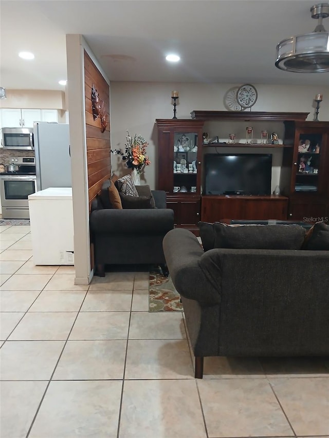 living room with light tile patterned flooring