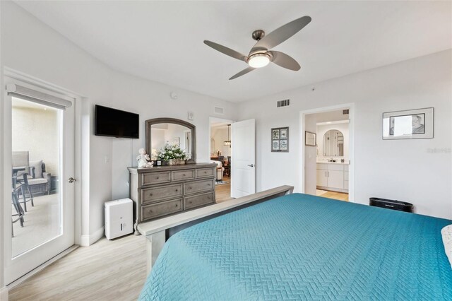 bedroom featuring connected bathroom, ceiling fan, and light hardwood / wood-style flooring