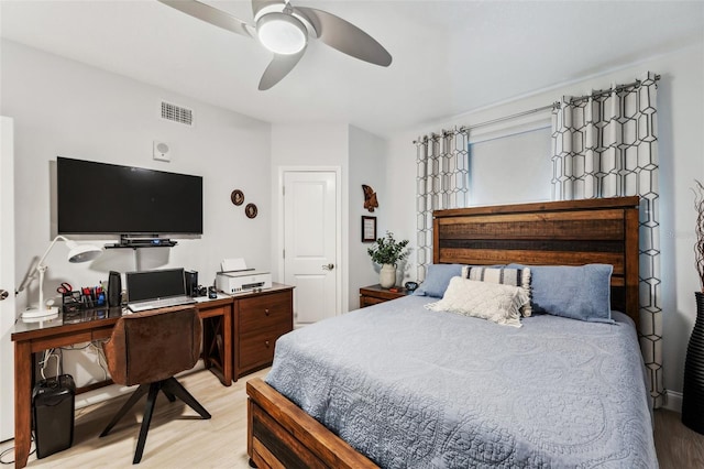 bedroom with light wood-type flooring and ceiling fan