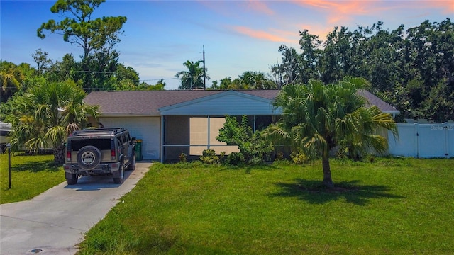 view of front of home featuring a lawn