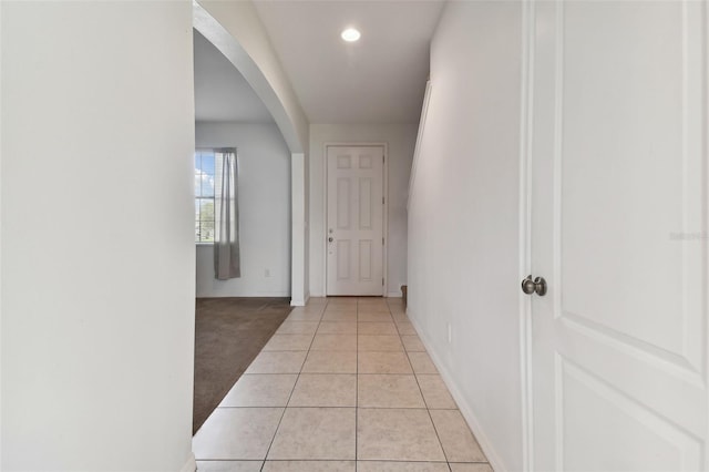 corridor featuring light tile patterned floors