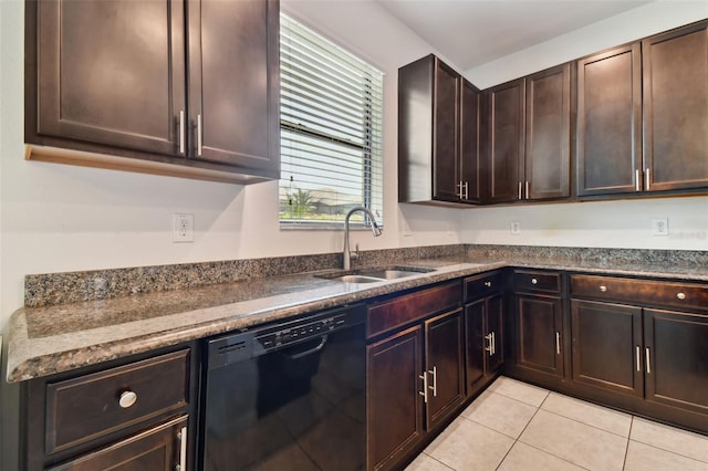 kitchen with sink, light tile patterned floors, dark brown cabinets, black dishwasher, and dark stone counters