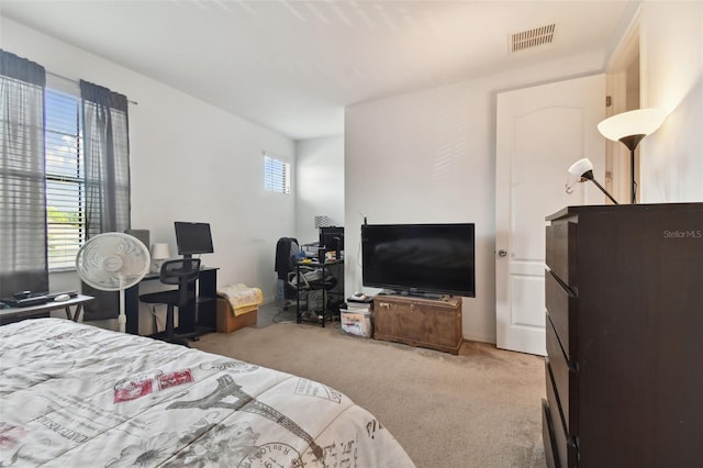 bedroom with light carpet