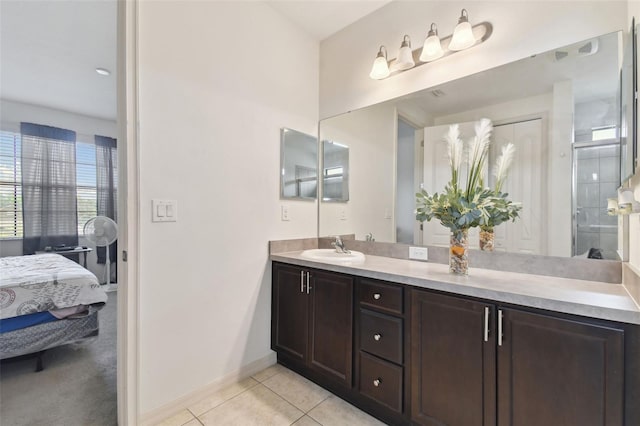 bathroom with tile patterned flooring and vanity