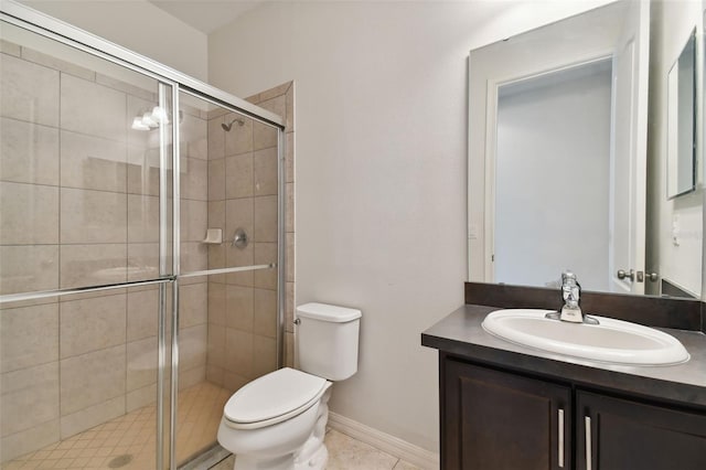 bathroom featuring vanity, toilet, and an enclosed shower