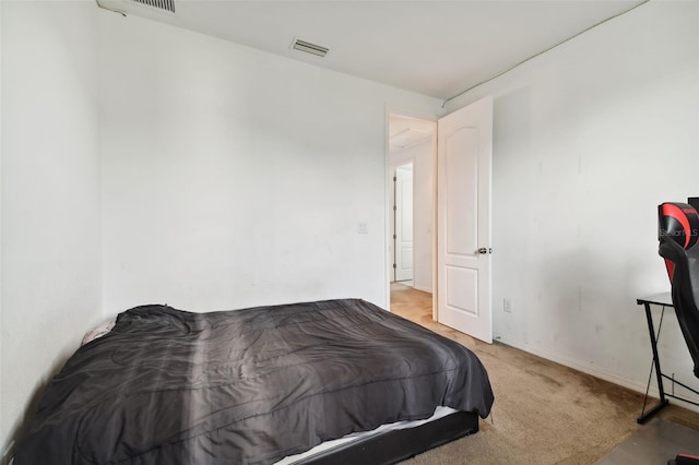 bedroom with light colored carpet