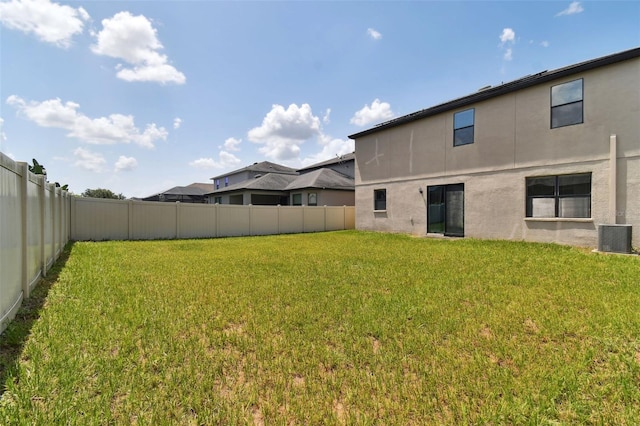 view of yard with central AC