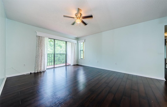 unfurnished room with dark hardwood / wood-style floors, a textured ceiling, and ceiling fan