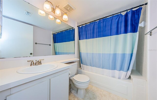 full bathroom featuring vanity, toilet, and shower / bath combo with shower curtain