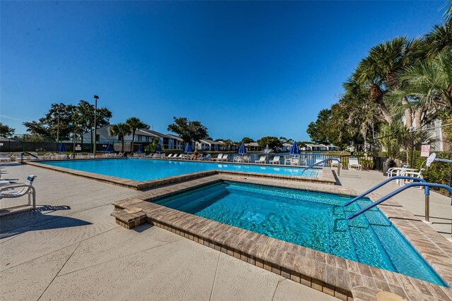 view of pool featuring a patio