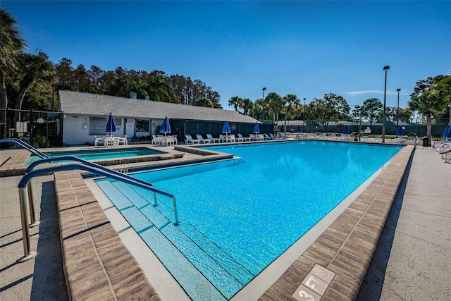 view of swimming pool with a patio