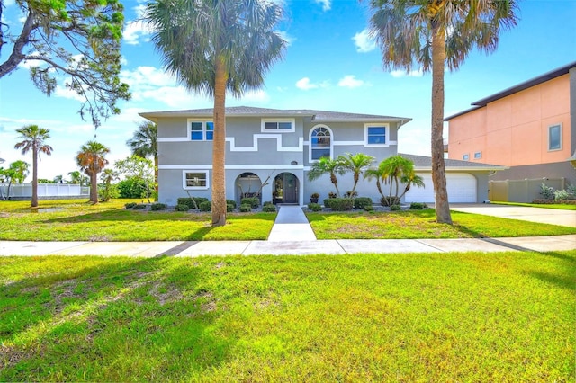 view of front of home with a garage and a front yard