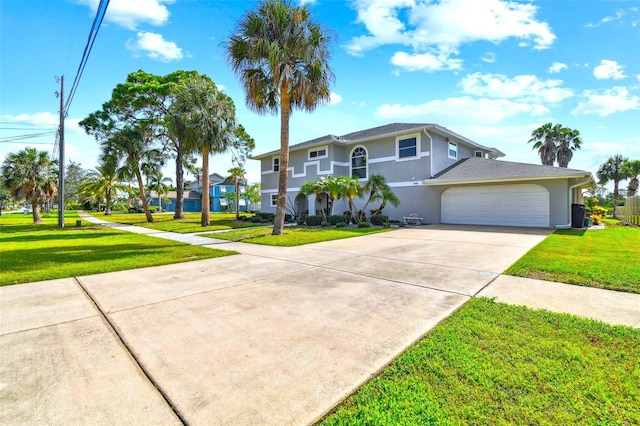 view of front facade with a garage and a front yard